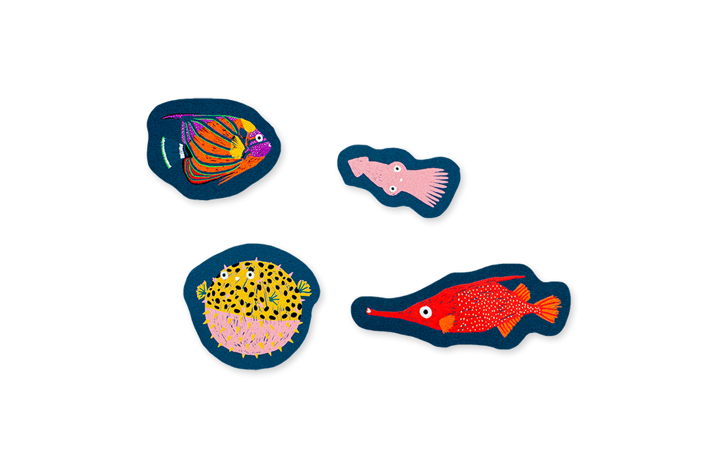 Four colorful fish stickers on a white background