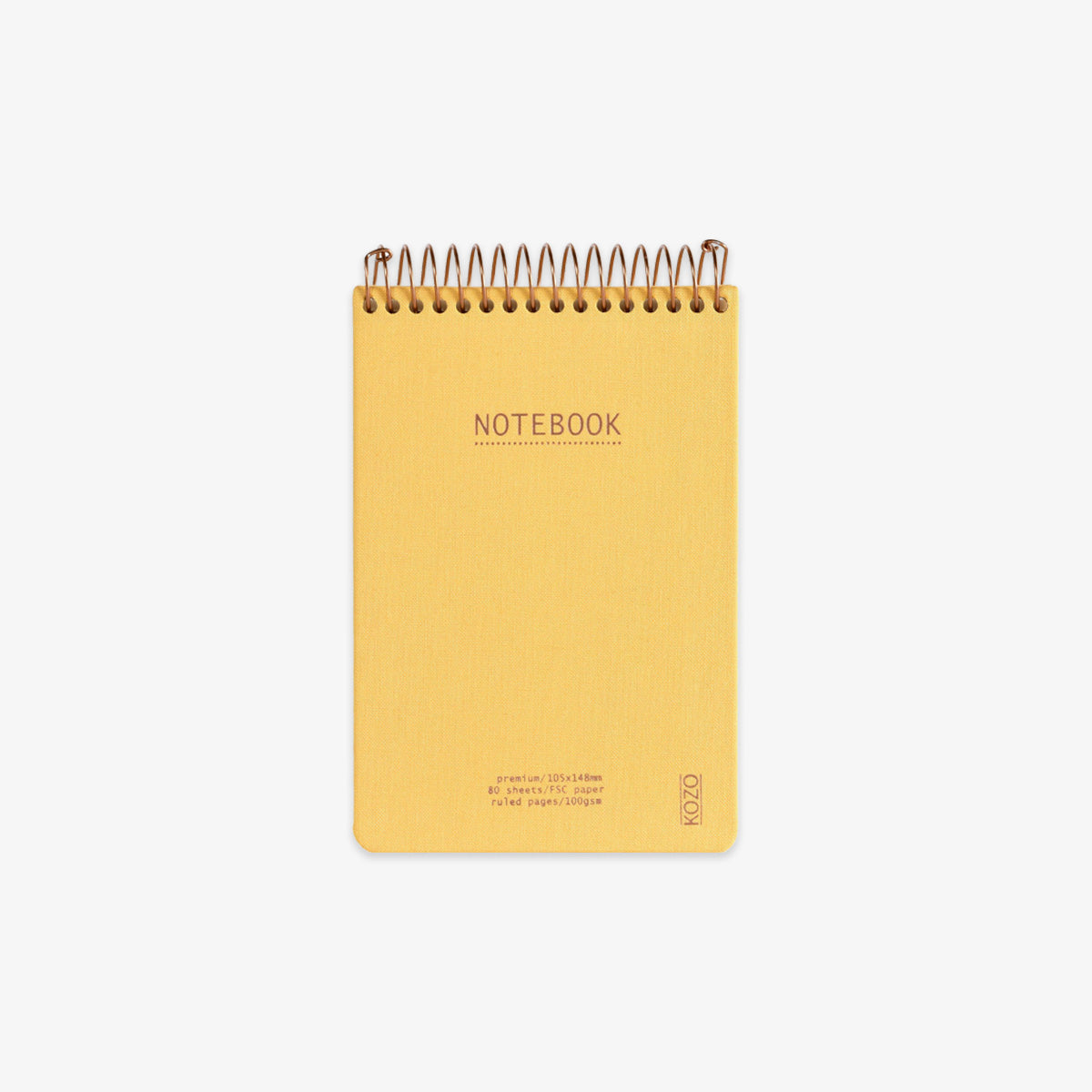 Yellow notebook with spiral binding on a white background