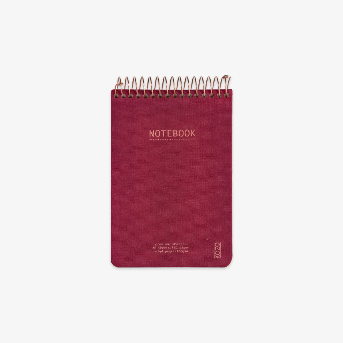 Red notebook with spiral binding on a white background