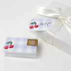 Pack of pocket notes with cherry design and 'thank you' label on a white background
