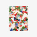 Notebook with colorful floral pattern on a white background