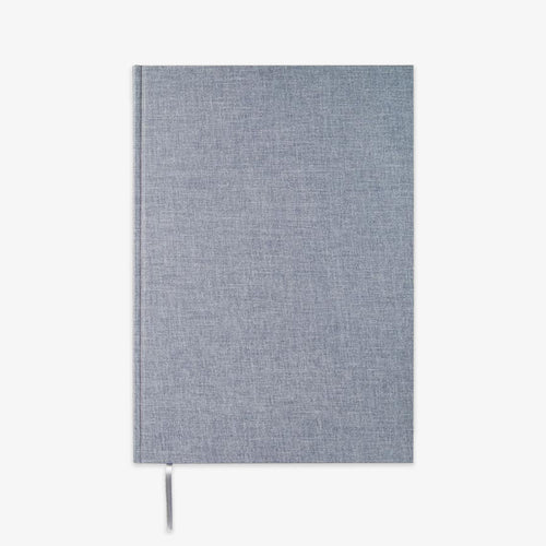 A hardcover notebook with a textured blue linen cover and a matching ribbon bookmark, shown against a plain white background.