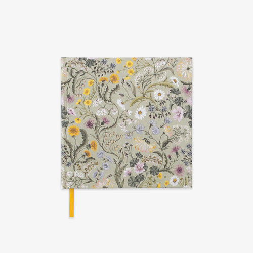 Floral hardcover notebook with yellow ribbon.