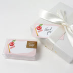 Pack of pocket notes with an apple design and a 'thank you' card in a decorative box on a white background.