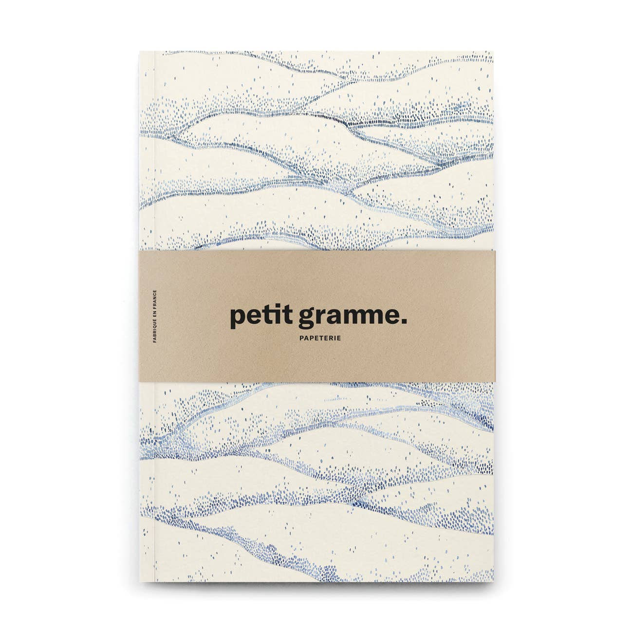 Notebook with wavy pattern and 'petit gramme' branding on a white background