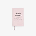 Pink journal titled 'Days to Remember: One Year Journal' on a white background