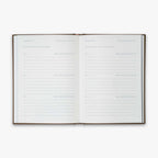 Open book from our Three Year Journal with the daily prompts on a white background
