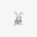 Vinyl sticker rabbit with glasses and a carrot on a white background