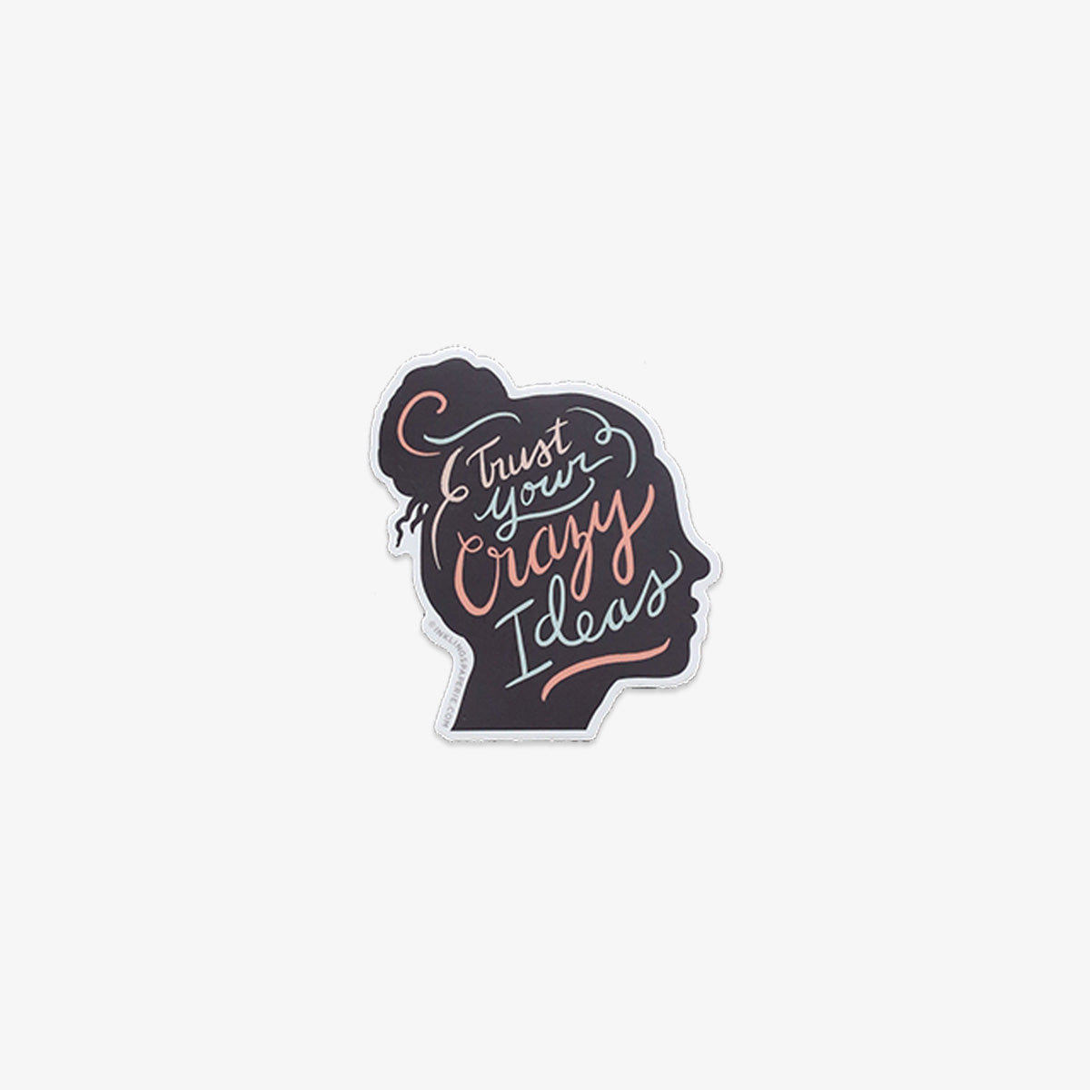 Vinyl sticker with silhouette of a head and 'Trust Your Crazy Ideas' text on a white background