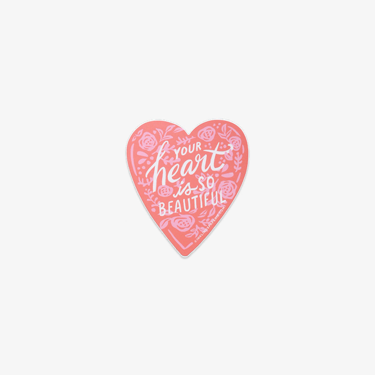 Heart-shaped pink vinyl sticker with text 'Your heart is so beautiful' on a white background