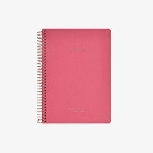 Pink notebook with spiral binding on a white background