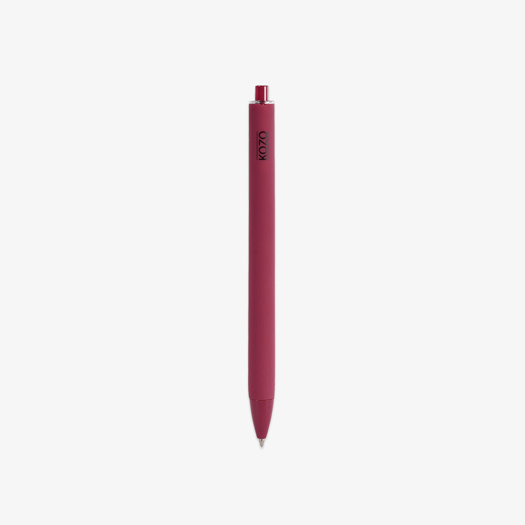 Red pen with a visible brand logo AND BLACK INK