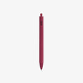 Red pen with a visible brand logo AND BLACK INK