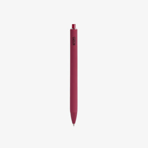 Red pen with a visible brand logo AND BLACK INK