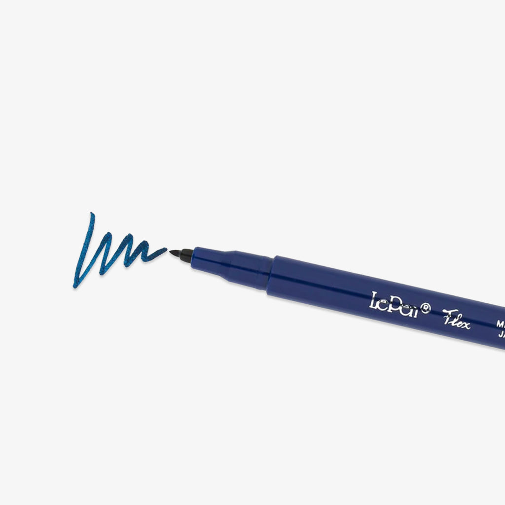 Navy blue pen with a sample of blue line on a white background