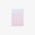 Gridded notepad on a white background