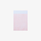Gridded notepad on a white background