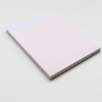 Notebook with a grid on a light background