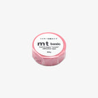 Pink roll of mt basic adhesive tape on a white background