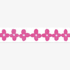 Row of pink flowers with white centers on a white background