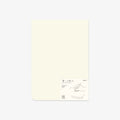 Plain notepad with minimal design on a light gray background