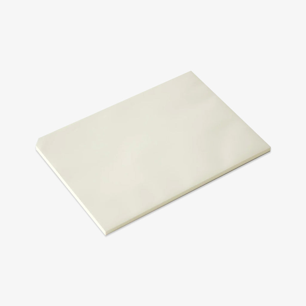 White notepad on a light gray background