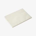 White notepad on a light gray background