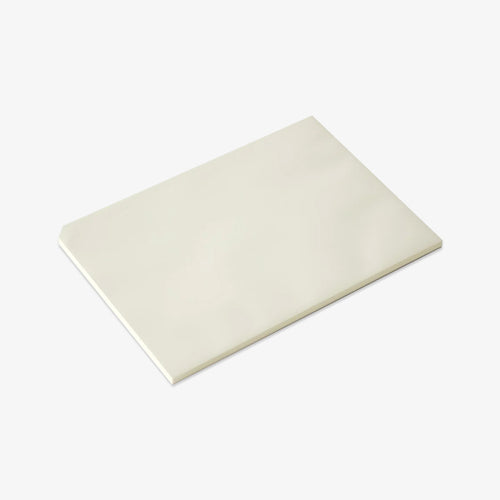 White notepad on a light gray background