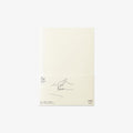 Notebook with minimal design on a light beige background