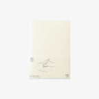 Notebook with minimal design on a light beige background