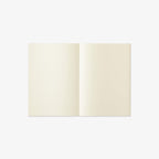 Open notebook with cream-colored pages on a white background
