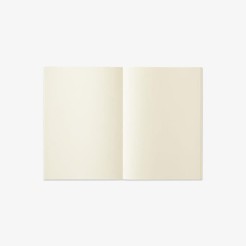 Open notebook with cream-colored pages on a white background