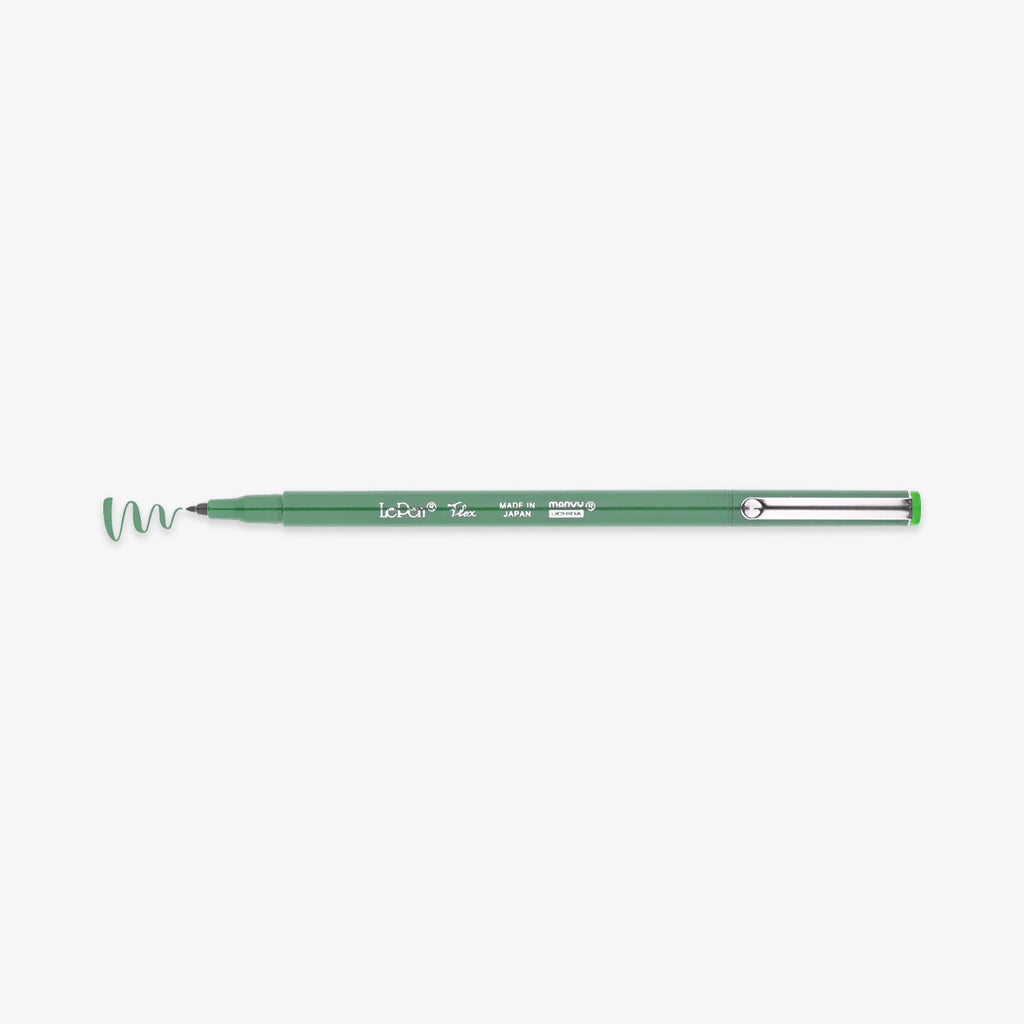 Green pen with a wavy line on a white background