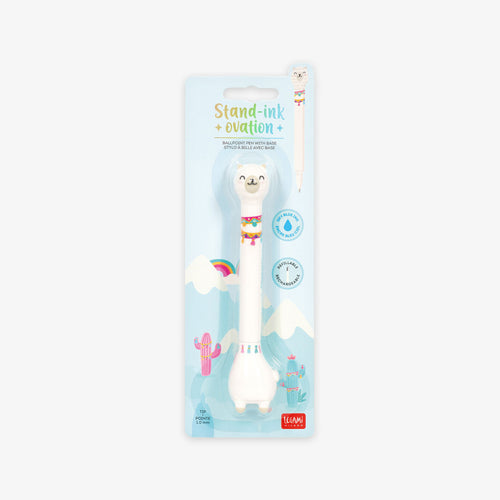 Unicorn-shaped ballpoint pen with base in packaging on a grey background