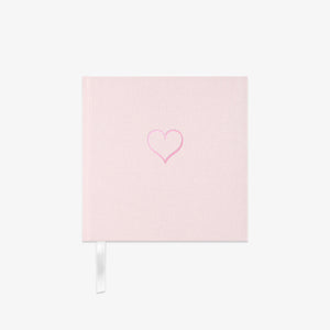 Light pink fabric Notebook with a heart design on a white background
