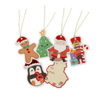Set of Christmas-themed gift tags including Santa, gingerbread man, penguin, and tree on a white background.