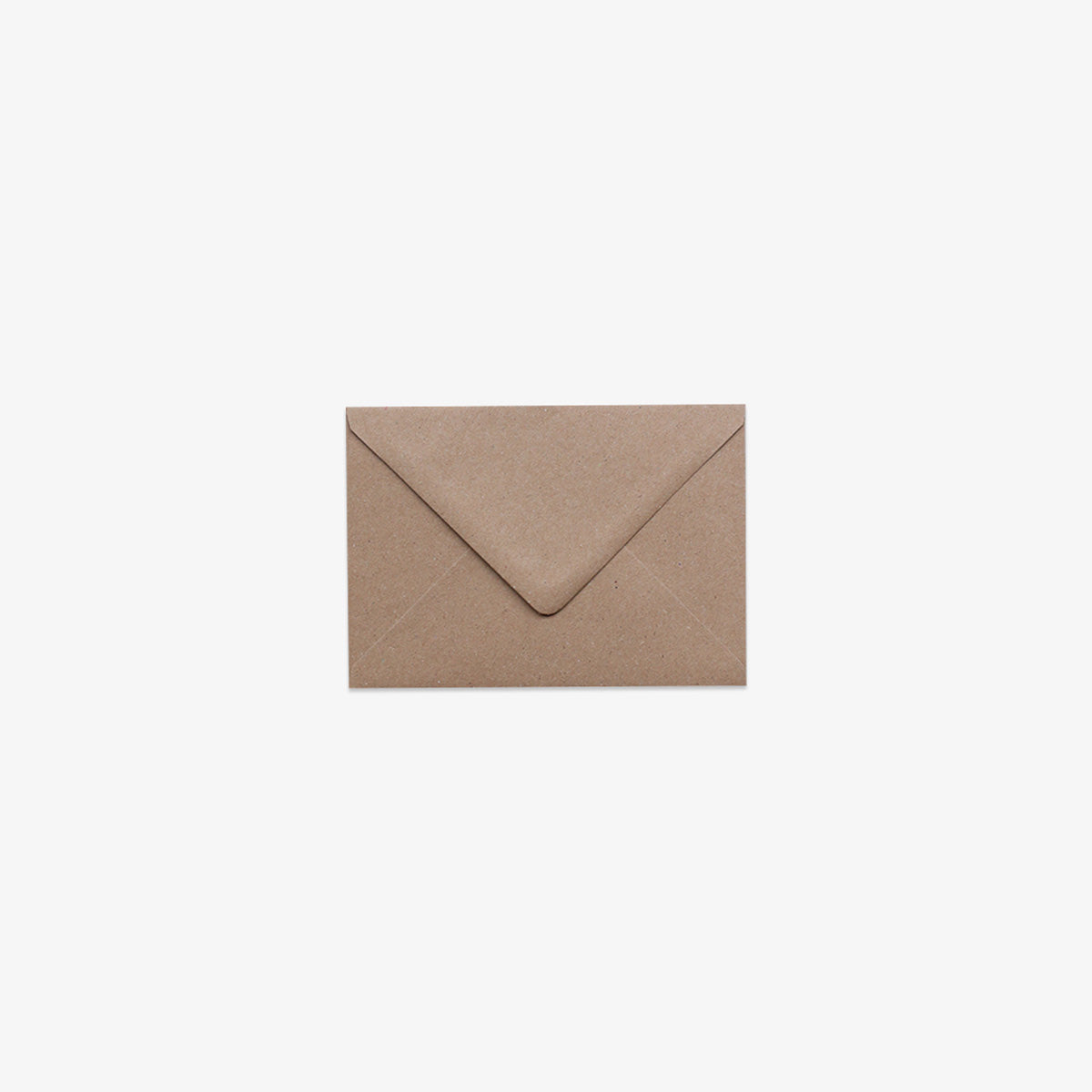 A closed C7 brown kraft v-flap envelope.