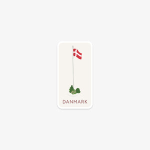 Vinyl sticker with a Danish flag and green bushes on a white background
