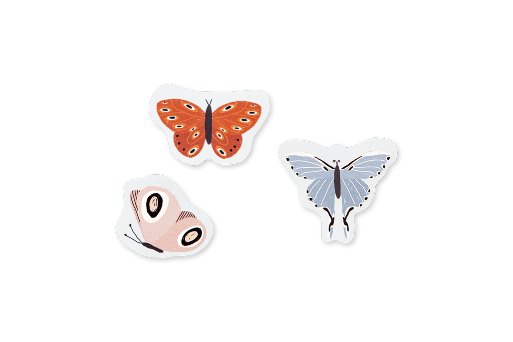 Three butterfly-shaped stickers on a white background