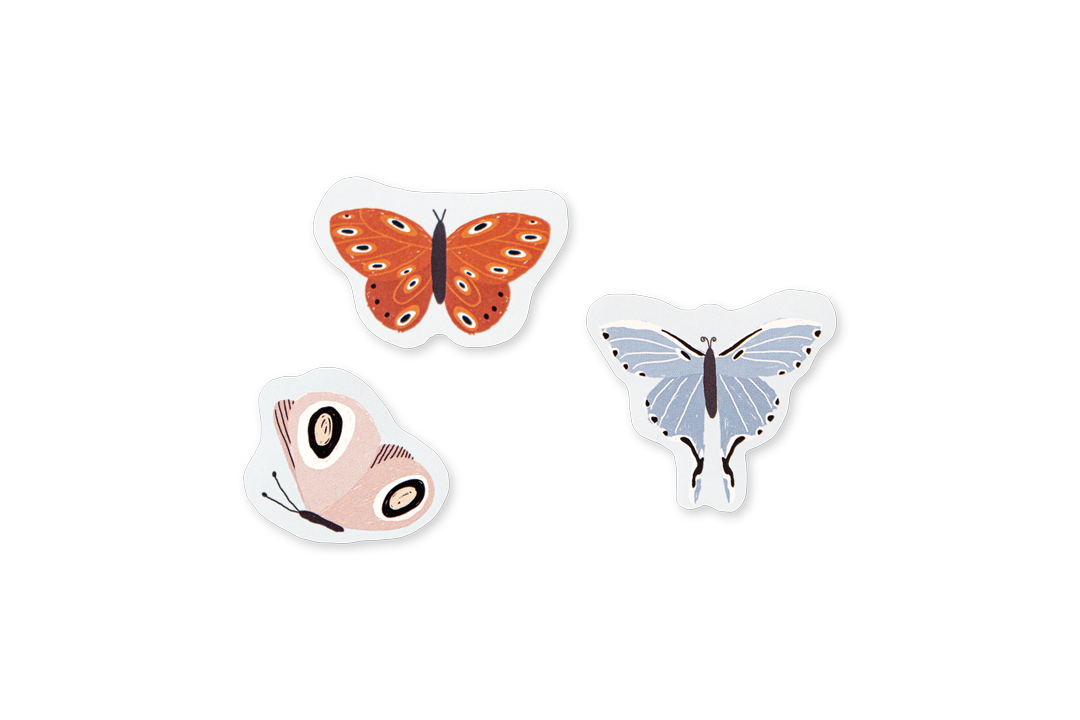 Three butterfly-shaped stickers on a white background