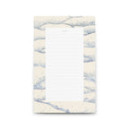 Notepad with blue and white abstract design on a white background