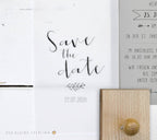 Save the date card with text and a small decorative element on a white background.