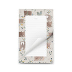 Notepad with bear illustrations on a white background