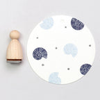 Shell stamp pad with blue and gray Shell stamps on a white background