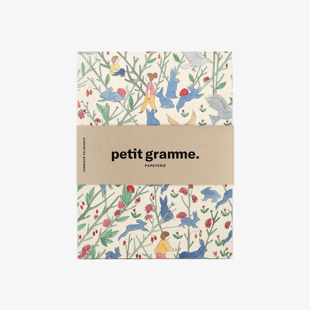 Notebook with colorful animal and nature pattern on a white background