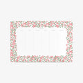 Notepad with floral border on a white background. Weekly schedule. 