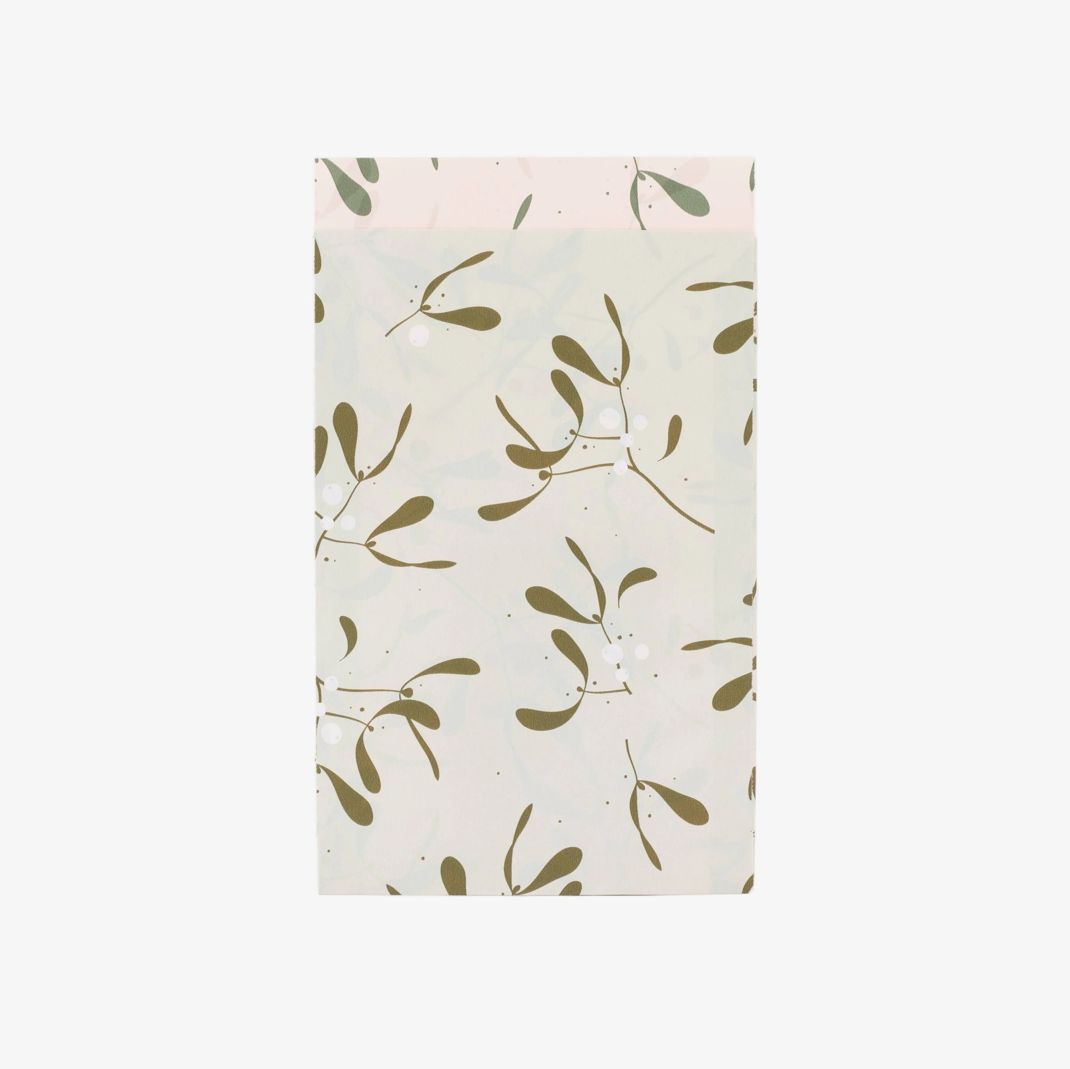Paper bag with a green leaf pattern on a white background