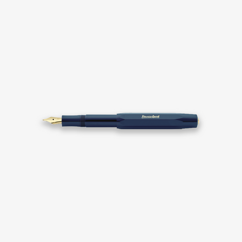 Kaweco Classic Sport fountain pen in navy color with a gold nib, lying on a flat surface.